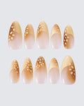 Bambi press on nails, sheer milky nude almond with a caramel french tip and cream speckles