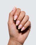 Buttercup press on nails, glossy soft pink almond with a butter yellow french tip and white polka dots