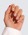 A Sip of Rouge press on nails, pearly pink almond with a deep red french tip